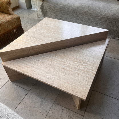 Beige stone coffee table in a living room setting. Made from travertine Italian by Up&UP. Vintage marble table