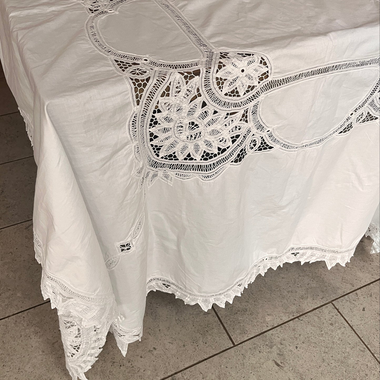 White lace garment on a tiled floor