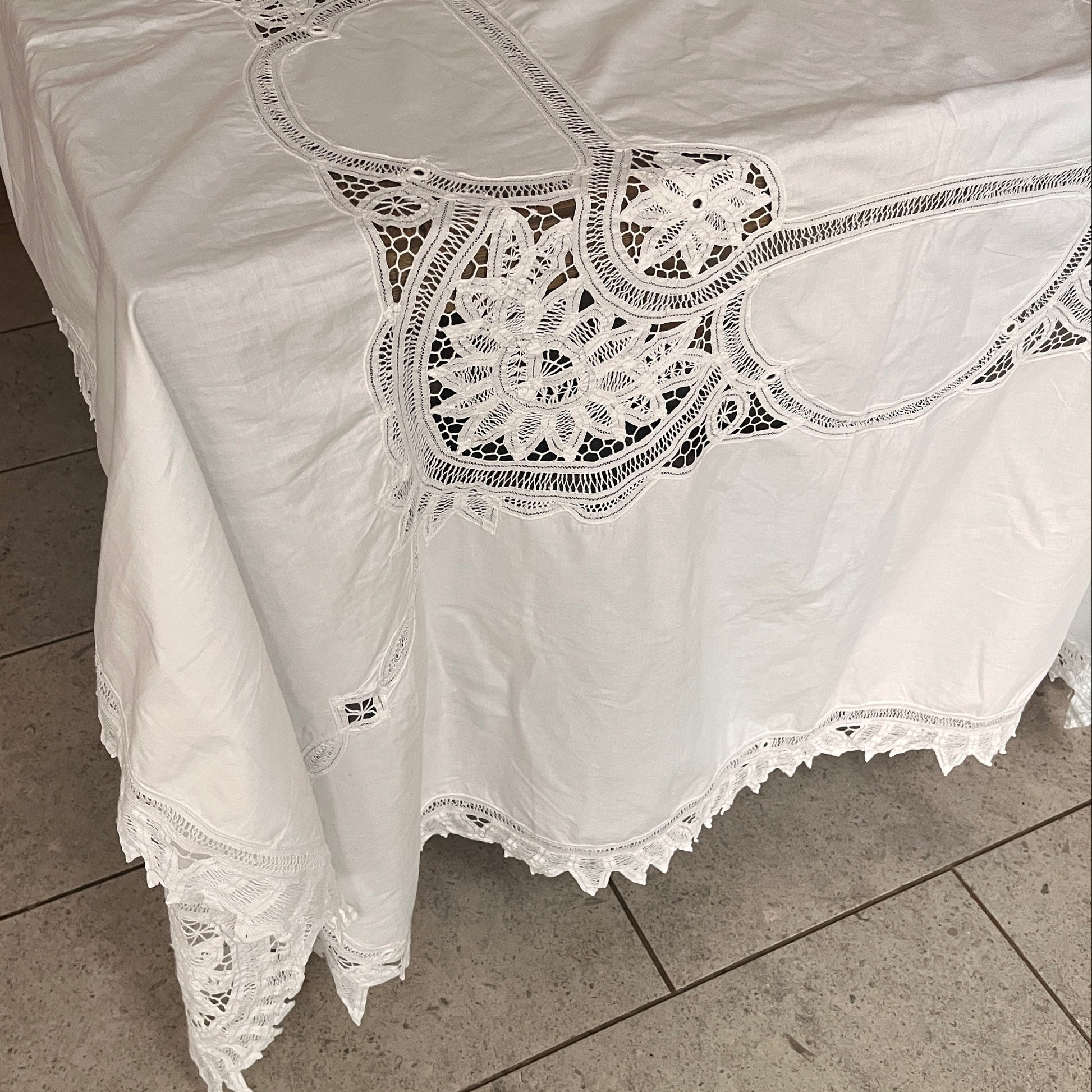 White lace garment on a tiled floor