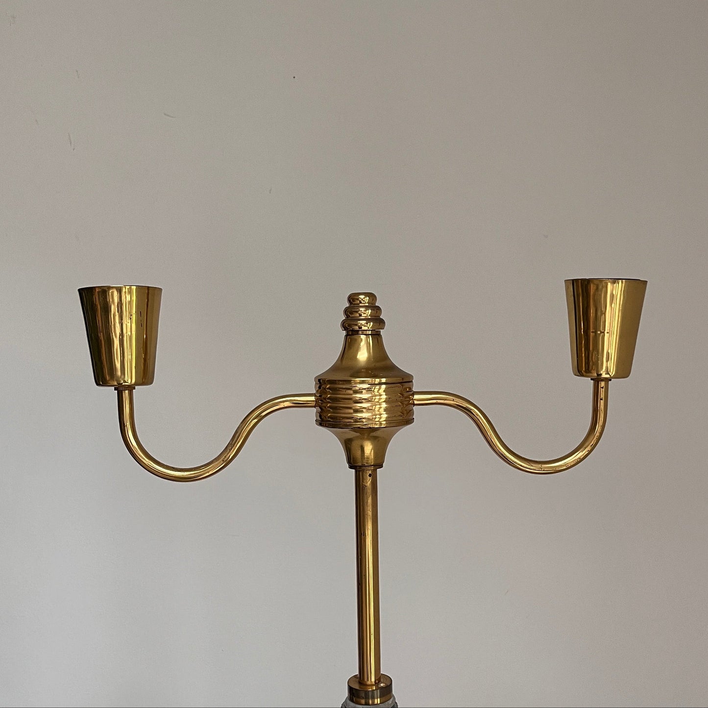 Gold ceiling light fixture on a plain background