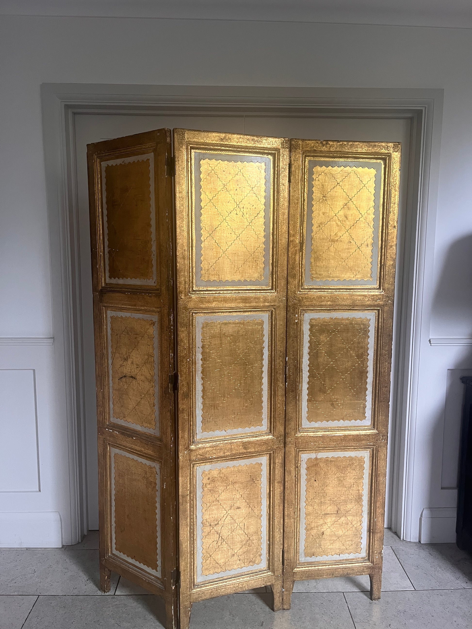 Mid-century Florentine three-panel folding screen with gold leaf decoration, circa 1960s