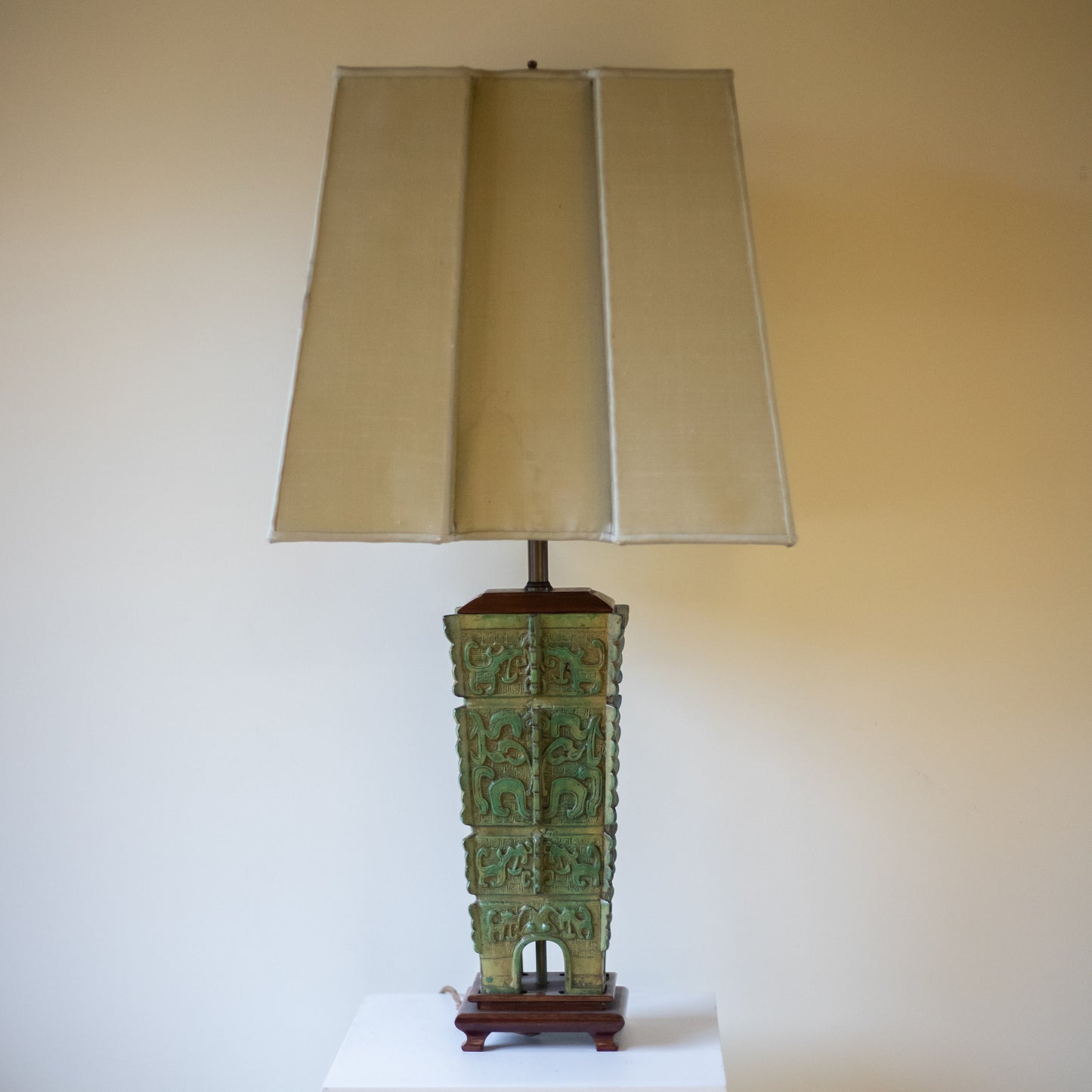 Chinese bronze table lamp with a neutral background