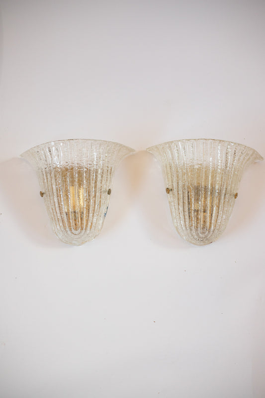 Two vintage-style wall sconces on a white wall. Murano glass Barovier and Toso