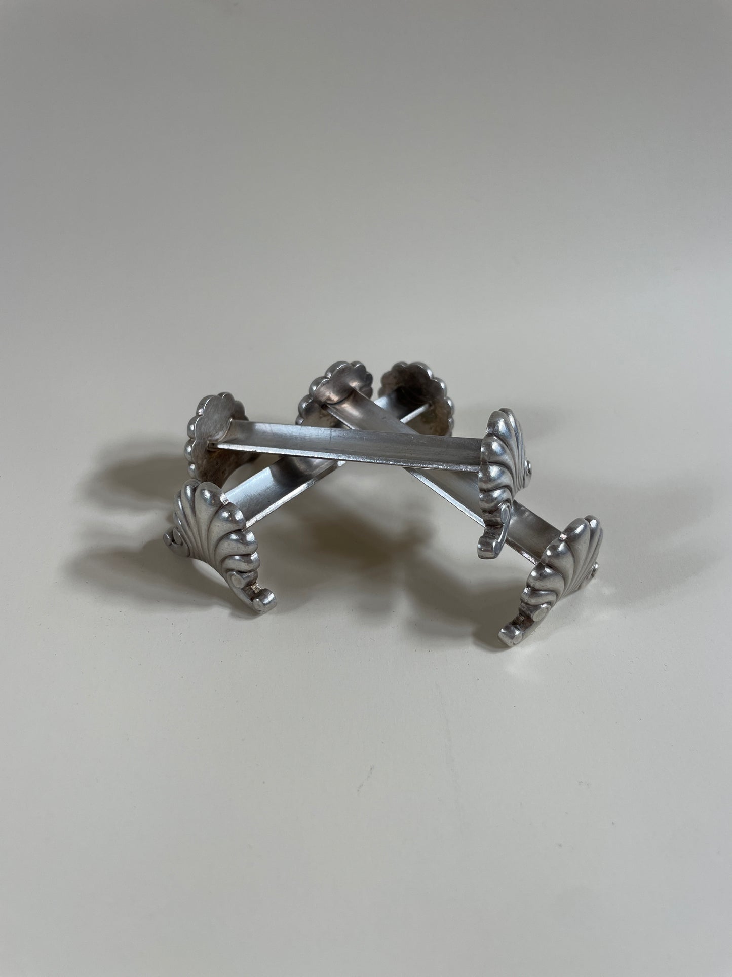 Silver knife rests on a neutral background