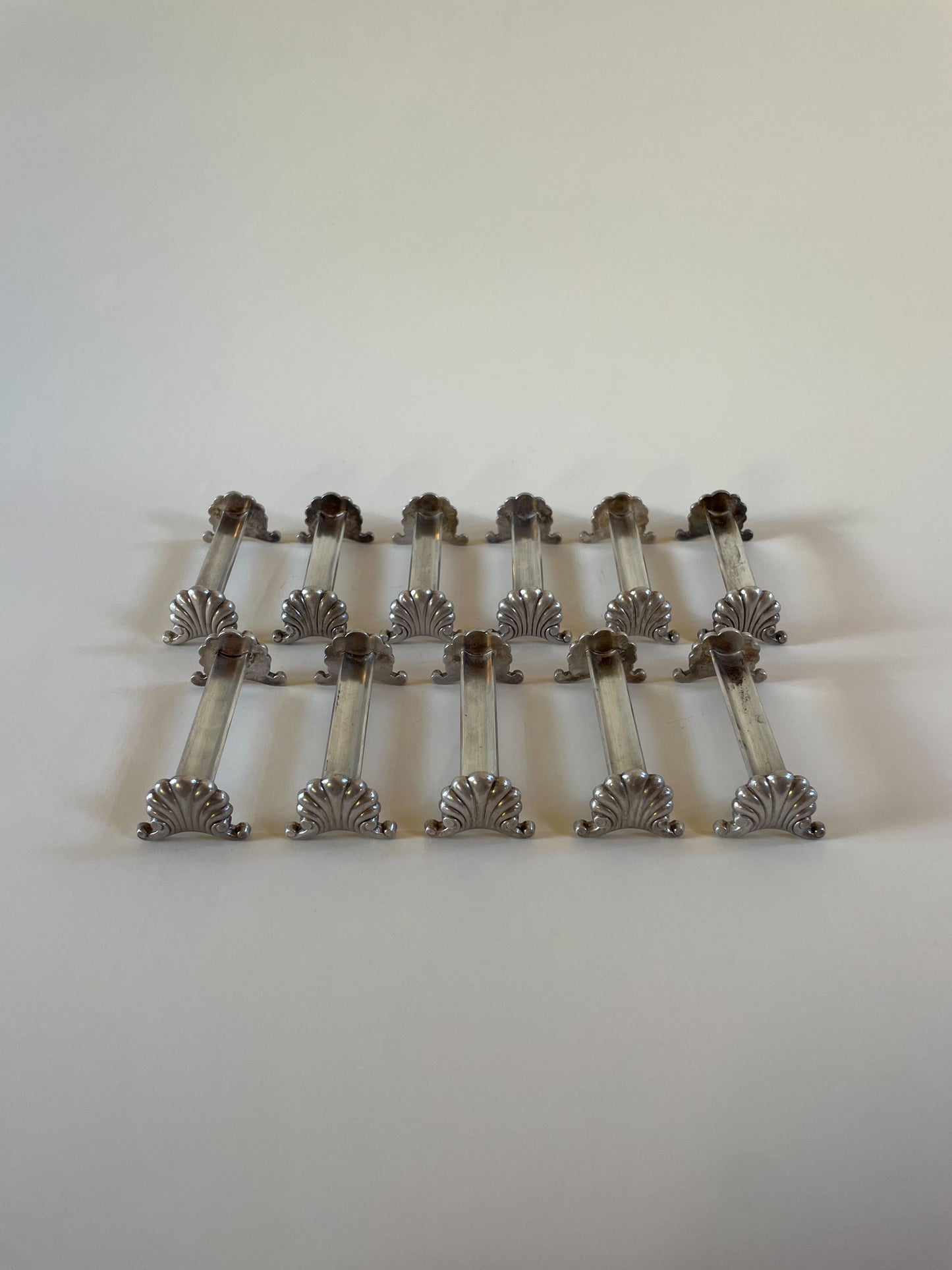 Silver knife rests on a neutral background
