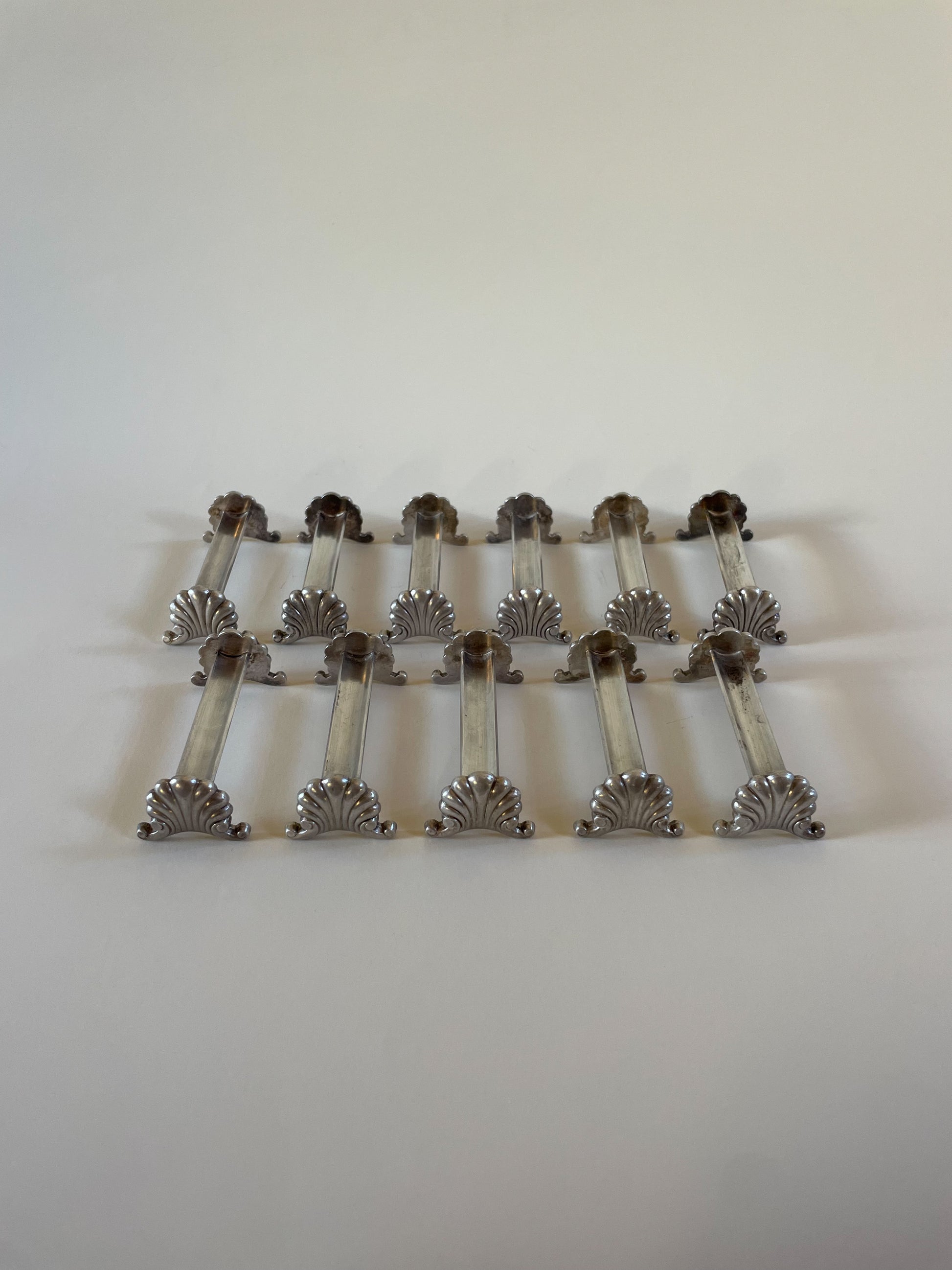 Silver knife rests on a neutral background