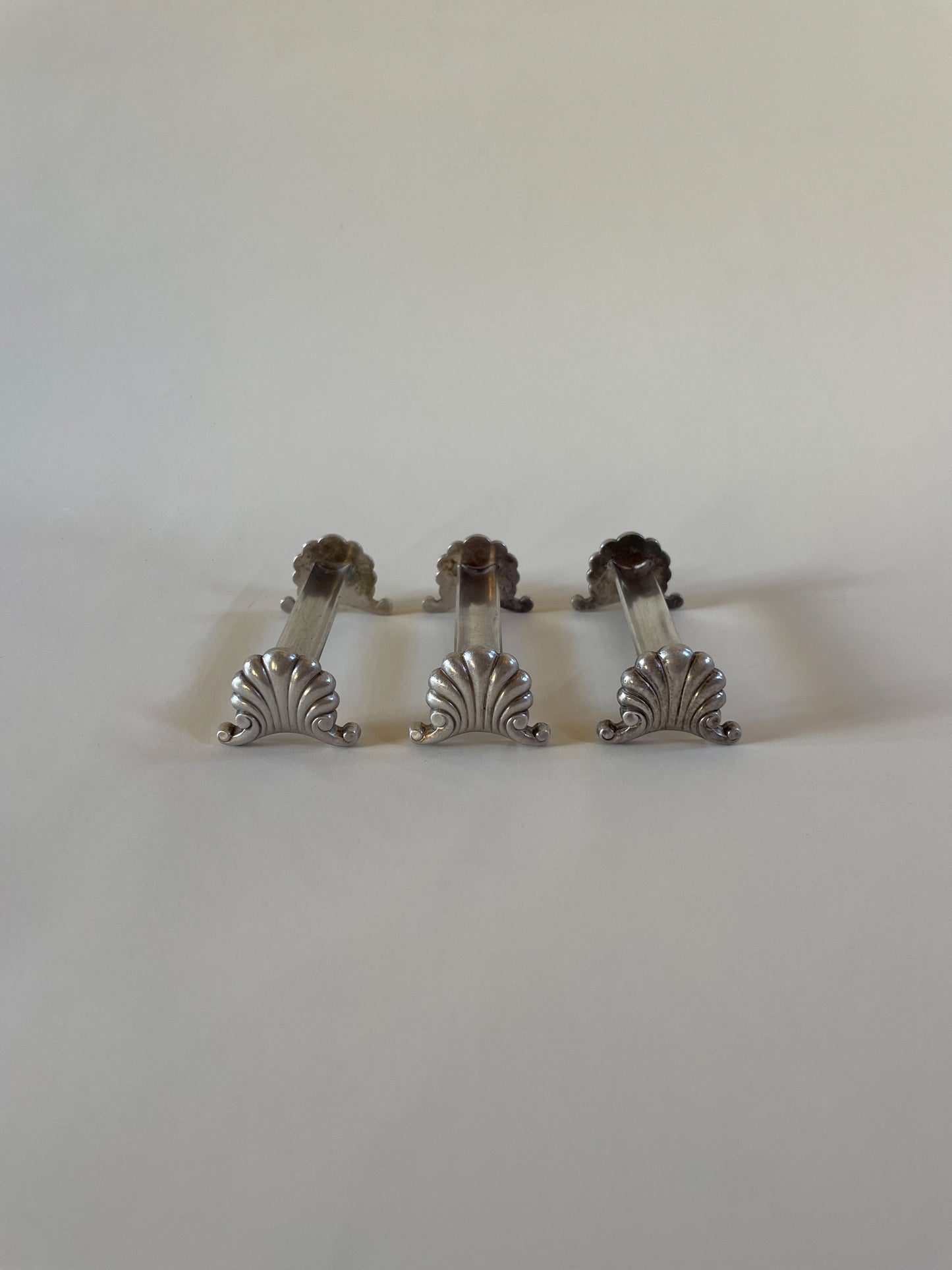 Silver knife rests on a neutral background