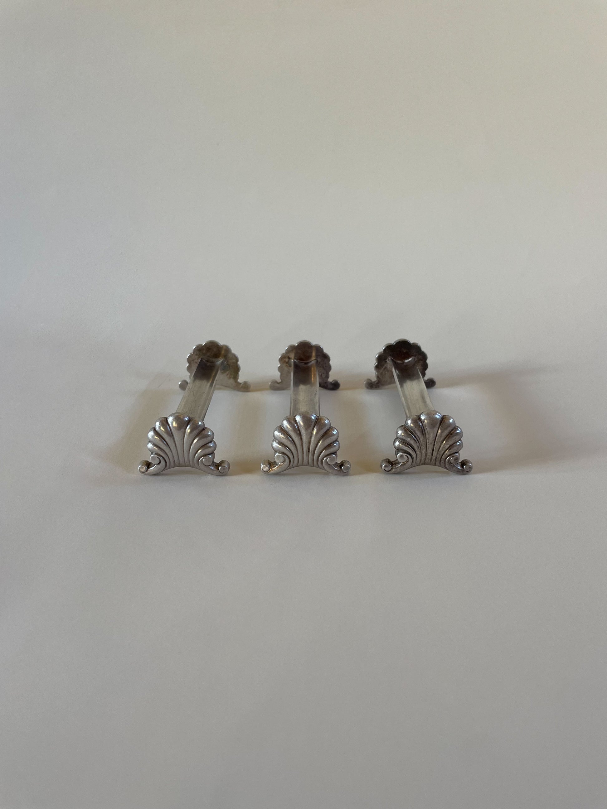 Silver knife rests on a neutral background