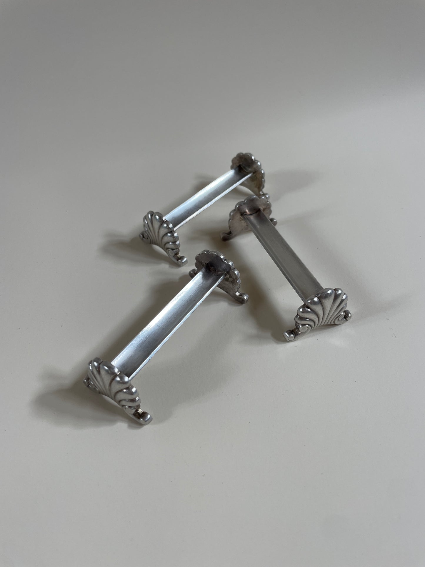 Silver knife rests on a neutral background