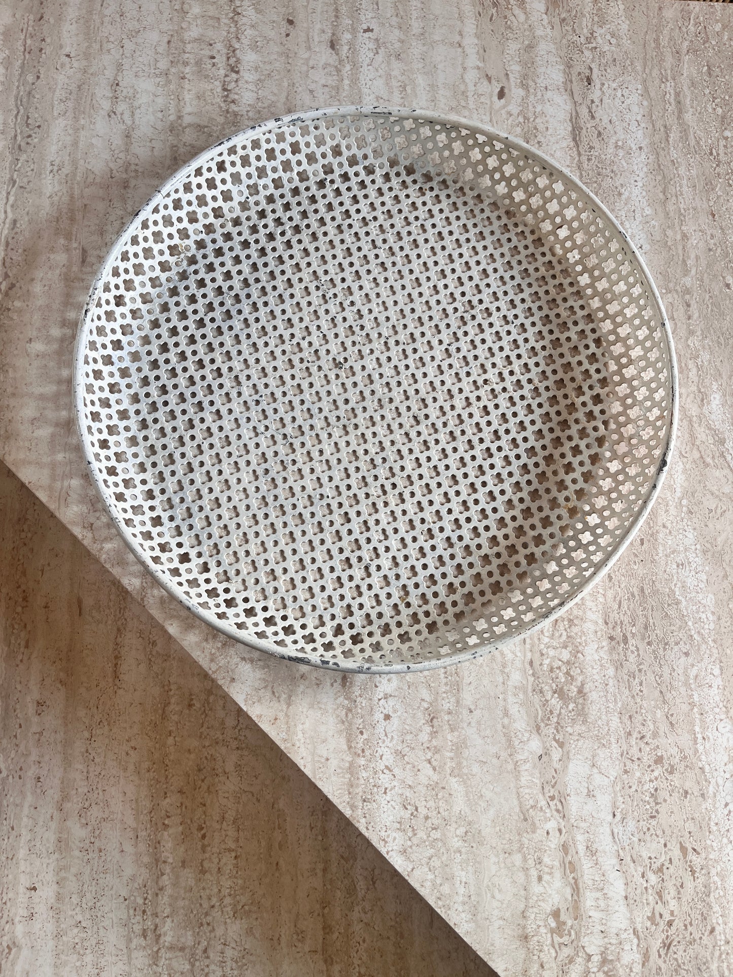 cream metal tray on beige speckled background