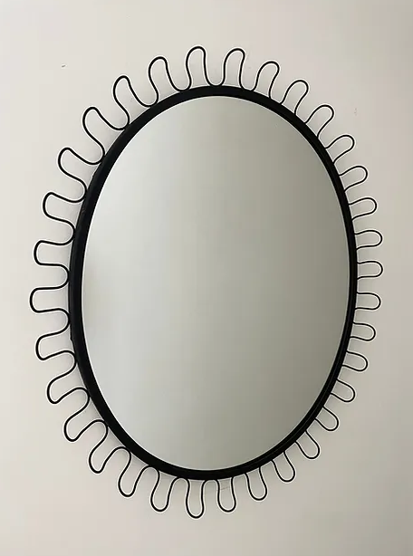 Undulato Mirror in manner of Josef Frank or style of Fontana Arte a black oval mirror with looped wavy wiggle frame
