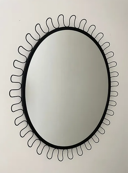 Undulato Mirror in manner of Josef Frank or style of Fontana Arte a black oval mirror with looped wavy wiggle frame