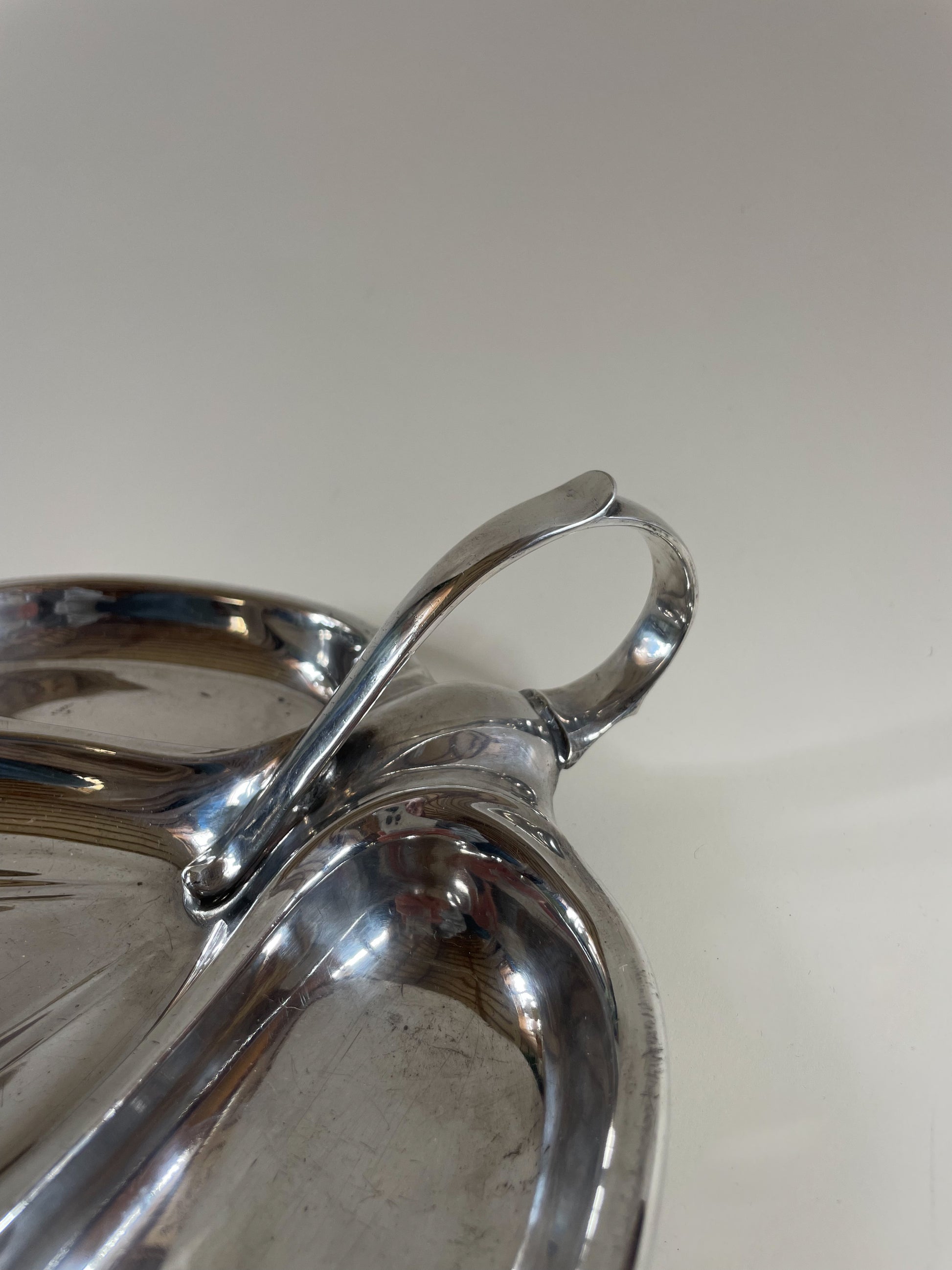 silver plate mappin and webb vintage serving dish with handle on light grey background