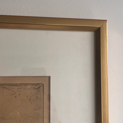 Ulf Trotzig Lithograph in a gold frame on a neutral wall